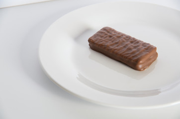 Chocolate biscuit on a white plate