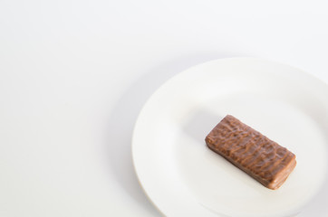 Chocolate biscuit on a white plate