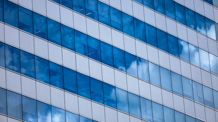 Fototapeta na wymiar Modern glass building reflecting sky
