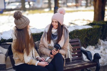 Obraz na płótnie Canvas Happy girls in a winter city