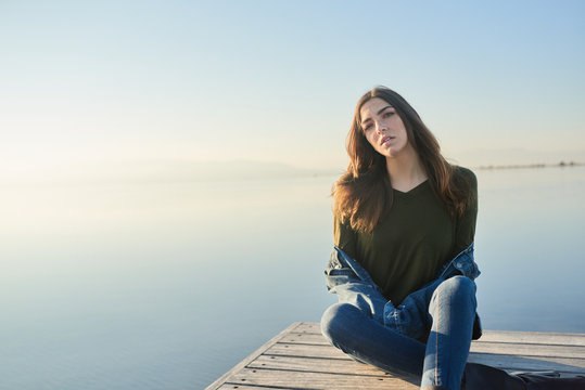 Sensual model posing on waterfront