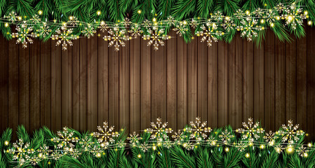 Fir Branch with Neon Lights and Golden Garland with Snowflakes on Wooden Background.
