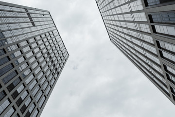 Fototapeta na wymiar Urban high buildings, look up