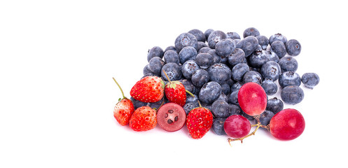 Mix of ripe sweet fruits and berries isolated on white