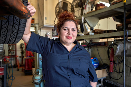 Portrait of Female Car Mechanic in Her Shop