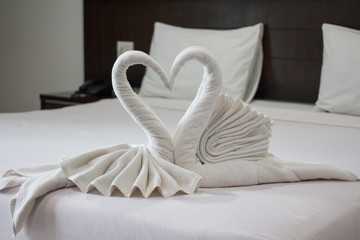 two lover white swan towels in hotel