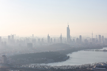 Nanjing, China. Severe air pollution, haze and poor visibility make the tall buildings in the city...