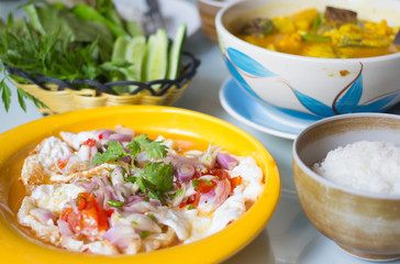 Spicy salted fried eggs with salad