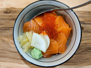 Salmon rice bowl with Soy-Wasabi sauce, topped with brilliant orange pearls of salmon roe.