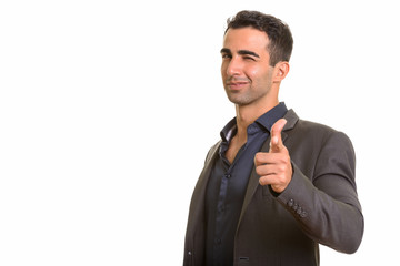 Persian businessman giving thumb up while winking