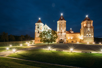 Fototapeta na wymiar Mir, Belarus. Mir Castle Complex In Evening Illumination Lightin