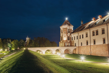 Fototapeta na wymiar Mir, Belarus. Mir Castle Complex In Evening Illumination Lightin