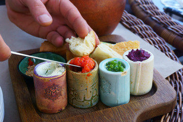 Oriental spices and appetizers on the table, male brush