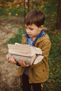 man carries wood pieces