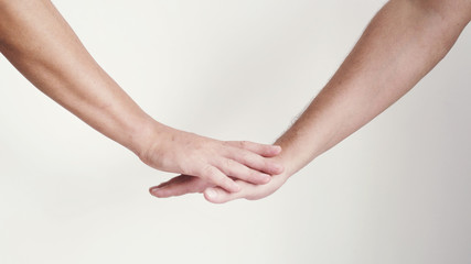 Hands getting together on a white background.