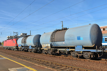 Fototapeta na wymiar Freight train with oil transporter carriages