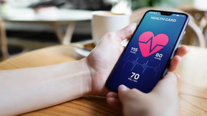 Health control application on smartphone with pulse and arterial pressure control. Concept of...