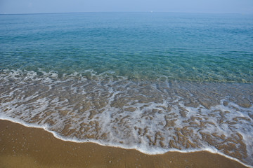 Tropical beach with turquoise clear water. Summer sandy beach with a blue sea water