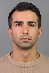 Obraz premium Face of young handsome man looking at camera