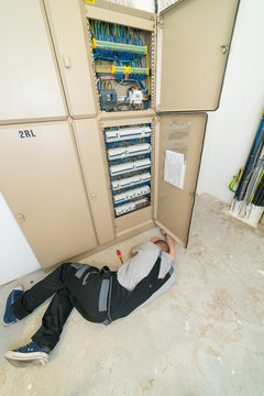electrician lying on the ground