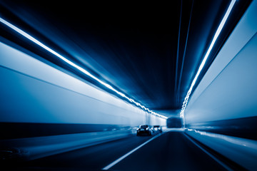 abstract car driving through tunnel.