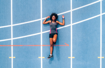 Black athlete woman on a race track
