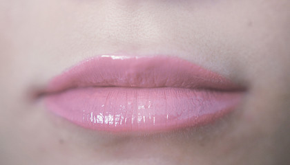 Close up beautiful pink lips of young woman