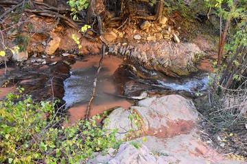 Kanarraville Falls, views from along the hiking trail of falls, stream, river, sandstone cliff formations Waterfall in Kanarra Creek Canyon by Zion National Park, Utah, USA.