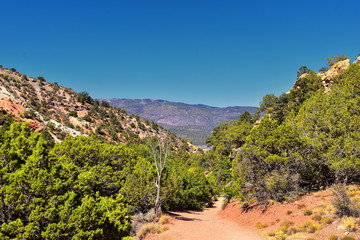 Kanarraville Falls, views from along the hiking trail of falls, stream, river, sandstone cliff formations Waterfall in Kanarra Creek Canyon by Zion National Park, Utah, USA.