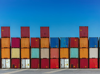 Stacked cargo containers in storage area of freight sea port terminal
