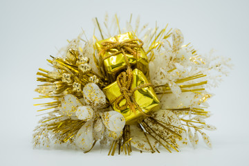 Christmas flower bouquet with golden gifts.