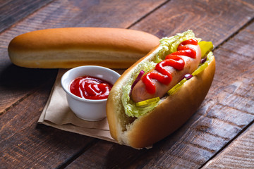Tasty hot dog with ketchup