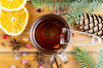 Christmas hot drink with cinnamon and spices on a wooden background. Winter hot drink