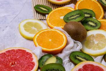 Fresh Fruits on a Light Stone Background. Copy space and a top view