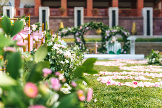 Pink flowers in an outdoors wedding