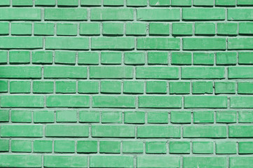 Fototapeta premium green brick wall close up