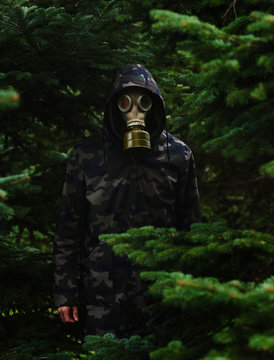 Man with gasmask in woods