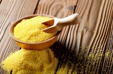 Scoop in Bowl of corn grits on kitchen table
