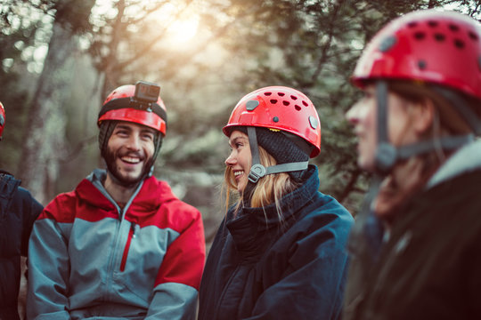 Friends laugh and enjoy the outdoors during a zip line course in upstate New York