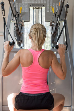 Woman working out with machine