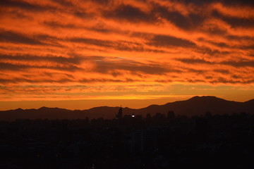 Obraz premium Sunset clouds and cityscape