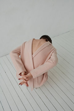 Young woman posing on floor