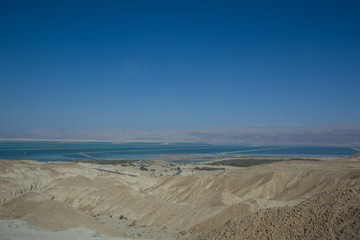 Curvy road with a view on Dead Sea at the end of a Summer day in Negev Desert