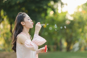 young woman with playing bubble balloons