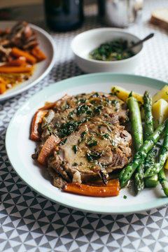 Sliced rosemary roast with vegetables and dressing