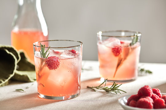 Kombucha with raspberry and rosemary on the rocks.