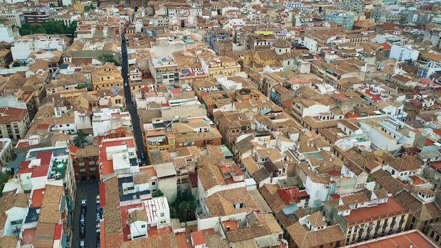 Aerial view of old tiled sloping roofs and narrow streets in Granada centre, Spain