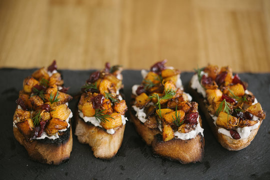 Bruschetta with blue cheese, butternut squash and cranberry