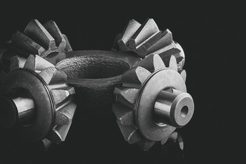 Gears, bearings and differential stars lie on the table close-up