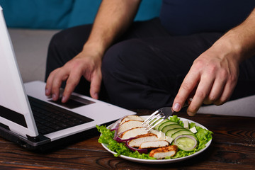 Healthy snack at workplace. Low calorie food, dieting, fit lifestyle. Man eating diet food during work time. weight loss for busy